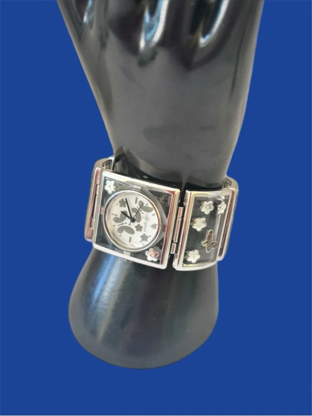 Brighton Gainesville watch features a design silver-tone butterflies & flowers.
